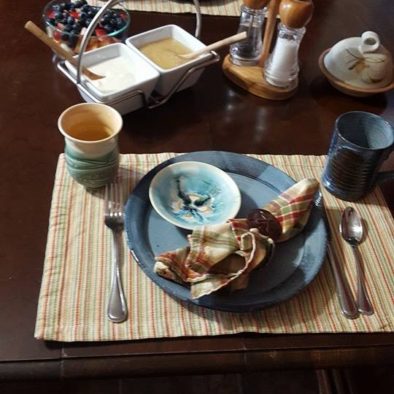 Breakfast table setting with Cape Breton pottery- Seaweed and Sod Farm B&B